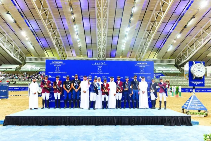 Overall winners of the 7th season of Qatar Equestrian Tour – Longines Hathab pose with Qatar Equestrian Federation President Bader Mohamed al-Darwish, Director of Programs at the Social and Sports Activities Support Fund Ahmed Salem al-Ali and Director of the Commercial Department at Al Shaqab Ahmed al-Hammadi after the conclusion of the final round at the indoor arena of Al Shaqab on Saturday.