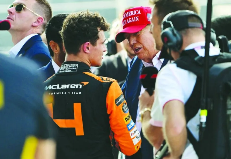 McLaren’s British driver Lando Norris is congratulated by former US President and 2024 presidential candidate Donald Trump after winning the 2024 Miami Grand Prix at Miami International Autodrome. (AFP)