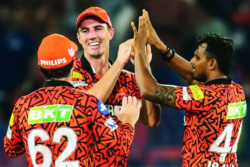 Sunrisers Hyderabad’s captain Pat Cummins celebrates with teammates after taking the wicket of Lucknow Super Giants’ Krunal Pandya in Hyderabad on Wednesday. (AFP)