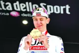UAE Team Emirates’ Tadej Pogacar celebrates on the podium after winning stage 7 of Giro d’Italia on Friday. (Reuters)