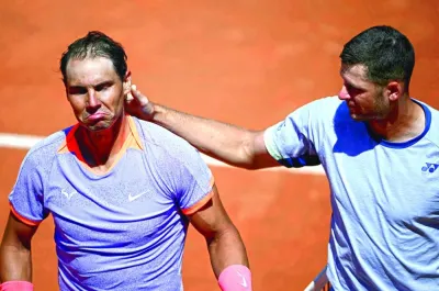 Spain’s Rafael Nadal (left) looks dejected after being eliminated by Poland’s Hubert Hurkacz during the Rome Open in Rome on Saturday. (AFP)