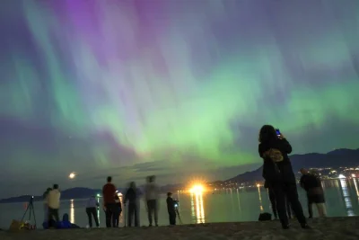 The *Aurora Borealis, also known as the &#039;Northern Lights&#039;, caused by a coronal mass ejection on the Sun, illuminates the sky over Jericho Beach in Vancouver, British Columbia, Canada.