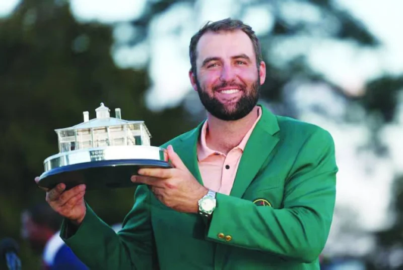 Scottie Scheffler of the US celebrates with his green jacket and the trophy after winning The Masters at Augusta National Golf Club, Augusta, Georgia, last month. (Reuters)