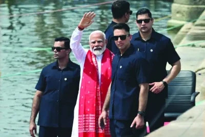 Indian Prime minister Narendra Modi waves after offering prayers on the banks of the Ganges River in Varanasi on Tuesday during the country’s ongoing general election. (AFP)