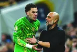 Manchester City’s goalkeeper Ederson (left) argues with Manchester City’s coach Pep Guardiola during the Premier League match against Tottenham Hotspur in London on Tuesday. (AFP)
