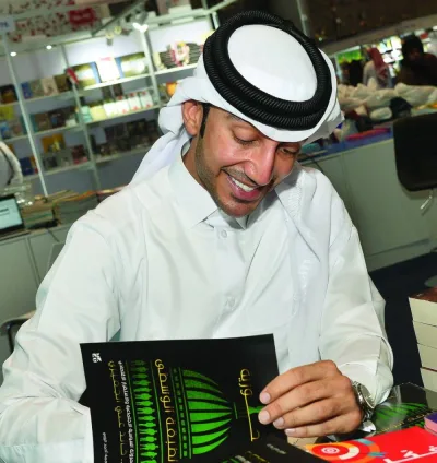 Dr Khalid Ali al-Jufairi signing his book at DIBF. PICTURES: Shaji Kayamkulam.