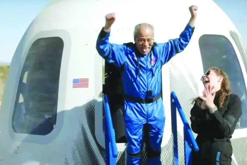 This screen grab taken from a Blue Origin broadcast shows Ed Dwight celebrating as he exits the Mission NS-25 crew capsule, upon landing near the Blue Origin base near Van Horn, Texas.