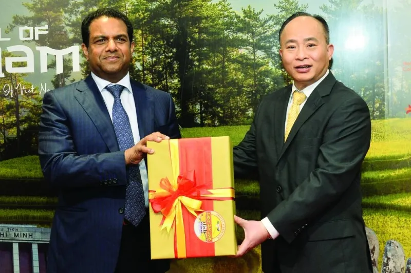 Vietnamese ambassador Tran Duc Hung handing over a gift to Dr Mohamed Althaf, director, LuLu Group International, during the &#039;Festival of Vietnam&#039; held on Monday at LuLu Hypermarket along D-Ring Road. PICTURE: Shaji Kayamkulam.