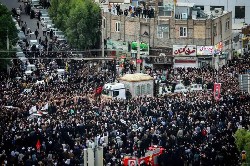 Mourners attend the funeral procession of Iran&#039;s President Ebrahim Raisi at a Shrine in Qom, on Tuesday.
