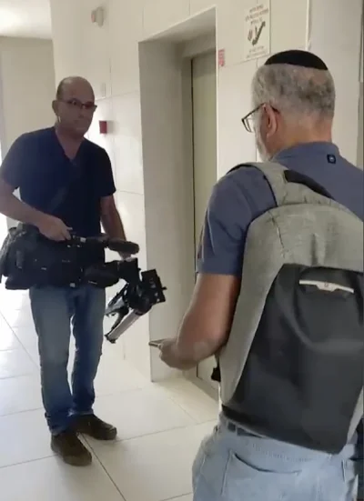 Israeli officials seize AP video equipment from an apartment block in Sderot, Southern Israel on Tuesday.