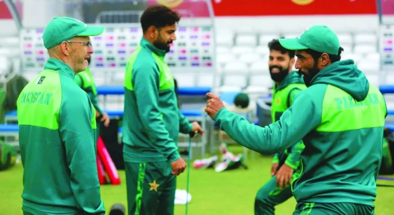 New Pakistan coach Gary Kirsten (left) of South Africa talks to paceman Mohamed Amir at Headingley, Leeds, England, on Tuesday. (@TheRealPCB).