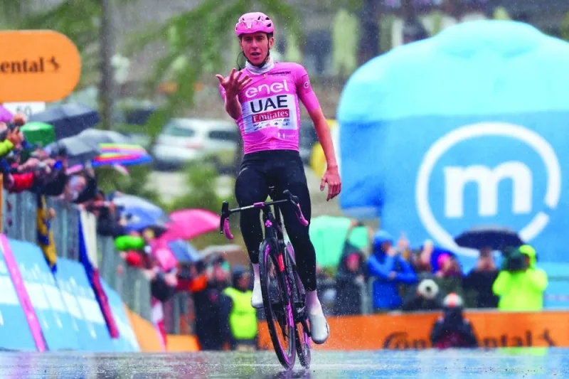 Team UAE’s Slovenian rider Tadej Pogacar crosses the finish line to win the 16th stage of the 107th Giro d’Italia cycling race, 206km between Livigno and Santa Cristina Val Gardena, on Tuesday. (AFP)