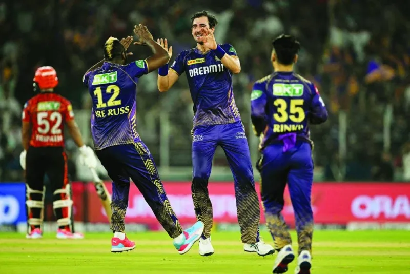 Kolkata Knight Riders’ Mitchell Starc (second right) celebrates with teammates after taking the wicket of Sunrisers Hyderabad’s Shahbaz Ahmed (not pictured) during the Indian Premier League first qualifier in Ahmedabad on Tuesday. (AFP)