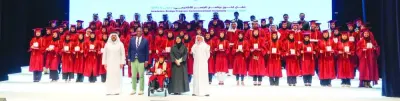 The graduates with dignitaries at the ceremony.