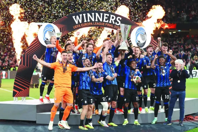 
Atalanta’s players celebrate with the trophy after winning the UEFA Europa League final against Bayer Leverkusen in Dublin. (AFP) 