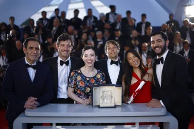 Director Sean Baker, Palme d&#039;Or award winner for the film "Anora", poses with Vache Tovmasyan, Samantha Quan, Mikey Madison, Alex Coco and Karren Karagulian during a photocall after the closing ceremony of the 77th Cannes Film Festival in Cannes, France on Saturday. REUTERS