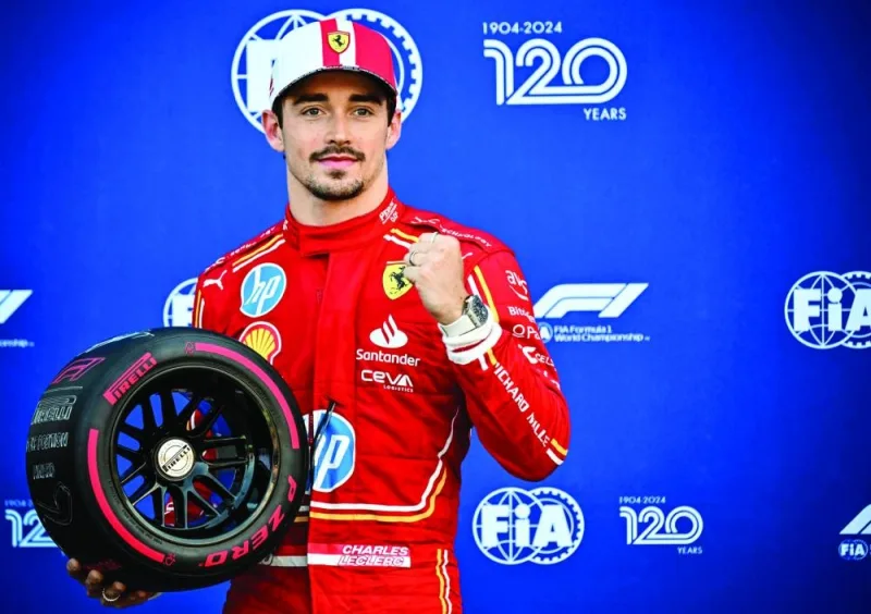 Ferrari driver Charles Leclerc poses after winning the qualifying session of the Monaco GP at the Circuit de Monaco on Saturday. (AFP)