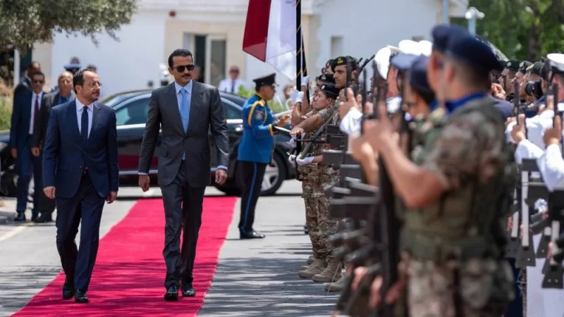 His Highness the Amir inspects a guard of honour during the official reception ceremony upon arrival at the Presidential Palace in Nicosia. 
