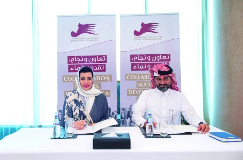 Aisha Alfardan, vice-chairwoman of QBWA, and Mohamed al-Naimi, CEO of AMLAK Holding, during the MoU signing ceremony held in Doha recently.
