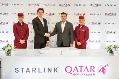 Mike Nicolls and Engr Badr Mohammed al-Meer announce the introduction of Starlink&#039;s innovative high-speed, low-latency Wi-Fi on three of its Boeing 777-300 aircraft at the Aircraft Interior Expo in Germany.