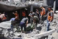 Members of the Palestinian civil defence recover a body from the rubble of a building after it was hit in an Israeli strike in the Jabalia refugee camp in the northern Gaza on Saturday. AFP