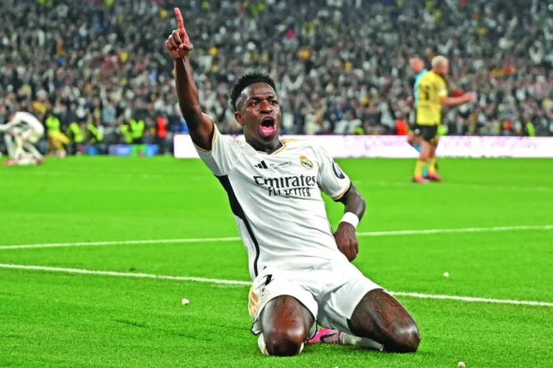 Real Madrid forward Vinicius Junior celebrates after scoring his team’s second goal during the UEFA Champions League final against Borussia Dortmund on Saturday. (AFP)