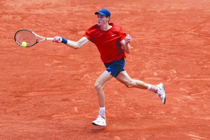 Italy’s Jannik Sinner plays a forehand return to Bulgaria’s Grigor Dimitrov during their quarter-final match at the French Open in Paris on Tuesday. (AFP)