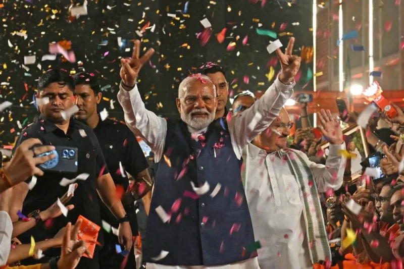 India’s Prime Minister Narendra Modi flashes victory sign as he arrives at the Bharatiya Janata Party (BJP) headquarters to celebrate the party’s win in country&#039;s general election, in New Delhi on Tuesday.