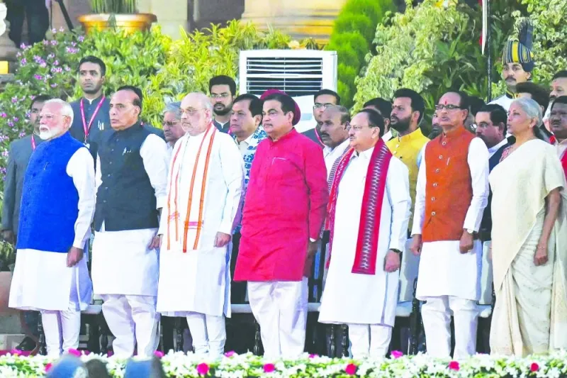 India's Prime Minister Narendra Modi (left) with cabinet ministers (front second left-right) Rajnath Singh, Amit Shah, Nitin Gadkari, Jagat Prakash Nadda, Shivraj Singh Chouhan and Nirmala Sitharaman attends the oath-taking ceremony at presidential palace Rashtrapati Bhavan in New Delhi yesterday.
