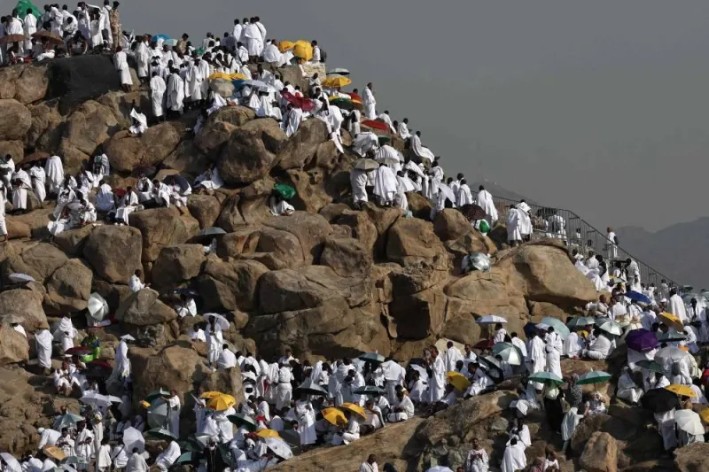 Muslim pilgrims pray at dawn on Saudi Arabia&#039;s Mount Arafat, also known as Jabal al-Rahma or Mount of Mercy, during the climax of the Haj pilgrimage on Saturday. AFP