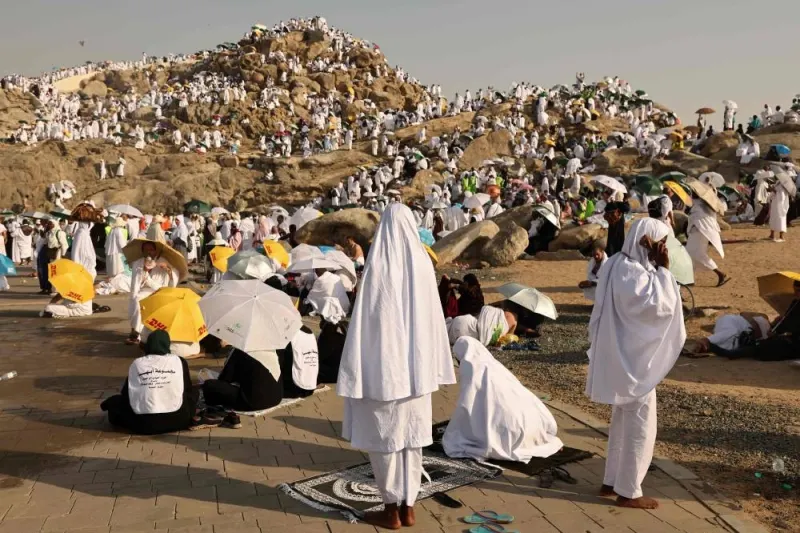 Muslim pilgrims pray at dawn on Saudi Arabia&#039;s Mount Arafat, during the climax of the Haj pilgrimage on Saturday. AFP