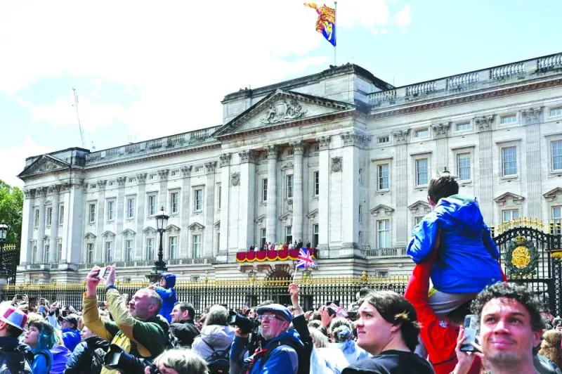 People gather outside Buckingham Palace.
