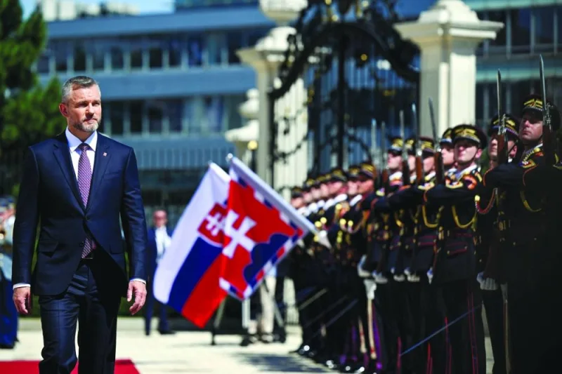 
Slovakia’s newly elected President Peter Pellegrini reviews the Honour Guard during a ceremony at the Presidential Palace, in Bratislava, Slovakia, yesterday. (Reuters) 