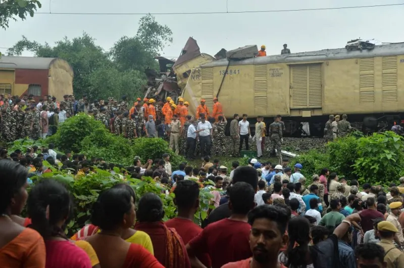 National Disaster Response Force (NDRF) and security personnel gather at the site of a collision between an passenger and a goods train in Nirmaljote, near Rangapani station in India&#039;s West Bengal state on Monday. AFP