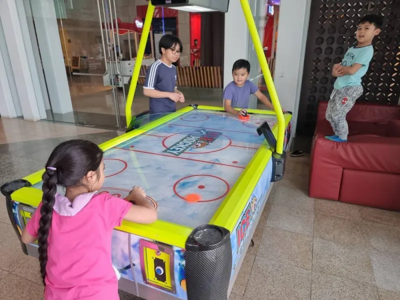 Children engaged in indoor activity.