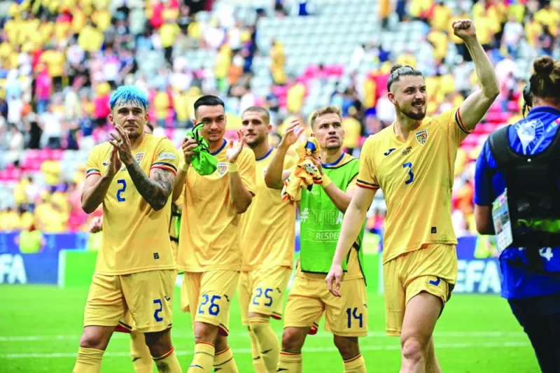 Romania players celebrate their victory over Ukraine in the UEFA Euro 2024 Group E match at the Munich Football Arena in Munich on Monday. (AFP)