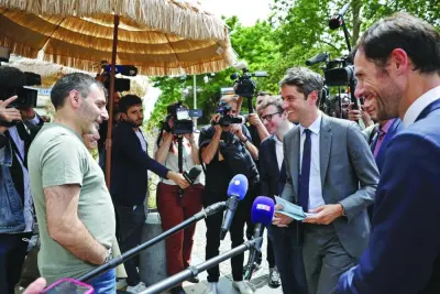 France&#039;s Prime Minister Gabriel Attal (2ndR) and French MP for the Renaissance group Mathieu Lefevre (R), candidate for his re-election in the 5th constituency of the Val-de-Marne department, meet with local residents in Le Perreux-sur-Marne, east of Paris, Monday.