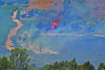 A fire blazes on the Israeli side of the Israel-Lebanon border following attacks from Lebanon, in northern Israel Tuesday.