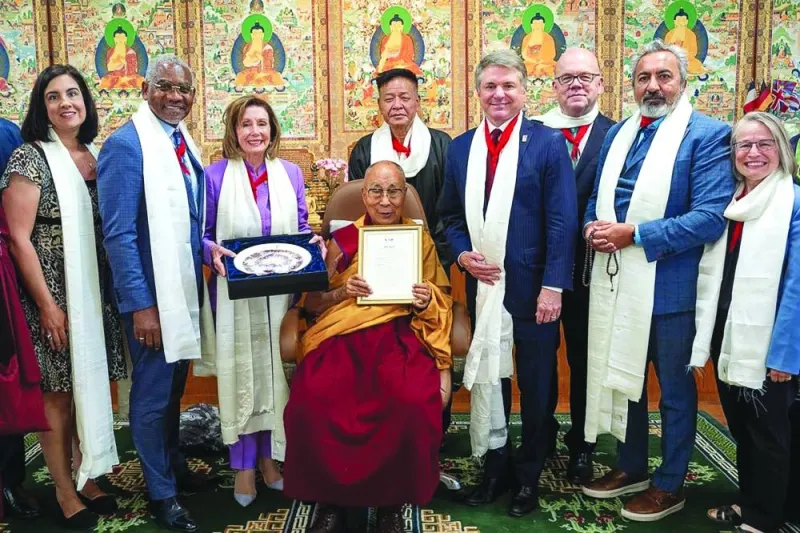US lawmakers including former House speaker Nancy Pelosi (third left) poses with Tibetan spiritual leader Dalai Lama (centre) for photos after a meeting at his residence in Dharamsala, India.