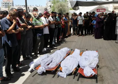 Mourners pray next to the bodies of Palestinians killed in Israeli strikes in Gaza City, on Friday. REUTERS
