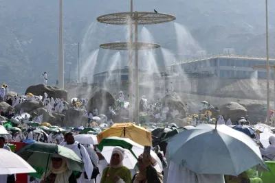 Mist dispensers refreshen Muslim pilgrims at the base of Saudi Arabia&#039;s Mount Arafat, also known as Jabal al-Rahma or Mount of Mercy, during the climax of the Haj pilgrimage on June 15. AFP
