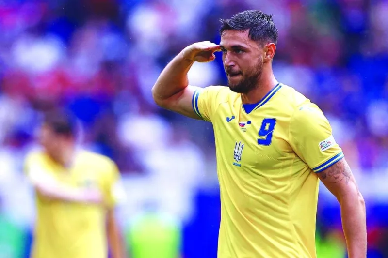 Ukraine&#039;s forward #09 Roman Yaremchuk celebrates scoring his team&#039;s second goal during the UEFA Euro 2024 Group E football match between Slovakia and Ukraine at the Duesseldorf Arena in Duesseldorf on Friday. (AFP)