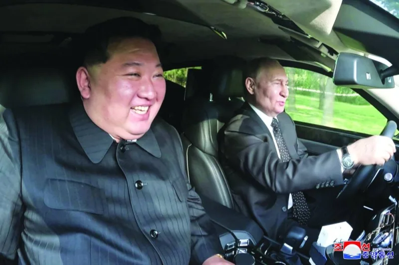 
Russia’s President Vladimir Putin and North Korea’s leader Kim Jong-un ride an Aurus car in Pyongyang, North Korea, in this image released by the Korean Central News Agency on Thursday. 