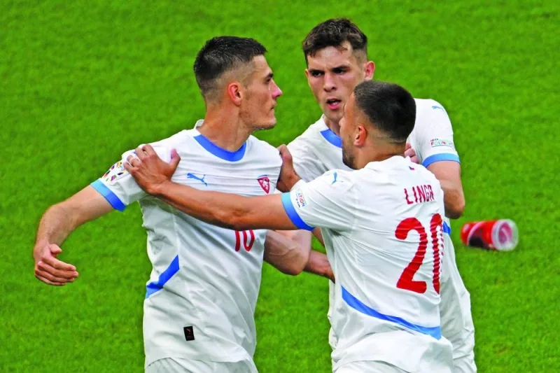 Czech Republic’s forward Patrik Schick (left) celebrates with defender Robin Hranac (centre) and midfielder Ondrej Lingr after scoring a goal during the UEFA Euro 2024 Group F match against Georgia at the Volksparkstadion in Hamburg on Saturday. (AFP)