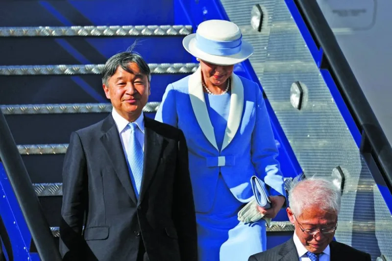 
Japanese ambassador to Britain Hajime Hayashi walks in front of Japan’s Emperor Naruhito and Empress Masako as they arrive on a state visit to Britain, at Stansted Airport near London, Britain. 