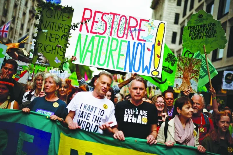 
British actress Emma Thompson, British environmentalist Chris Packham and British green energy entrepreneur Dale Vince lead demonstrators during the “Restore Nature Now” protest supported by Extinction Rebellion (XR), National Trust and WWF in London yesterday. 