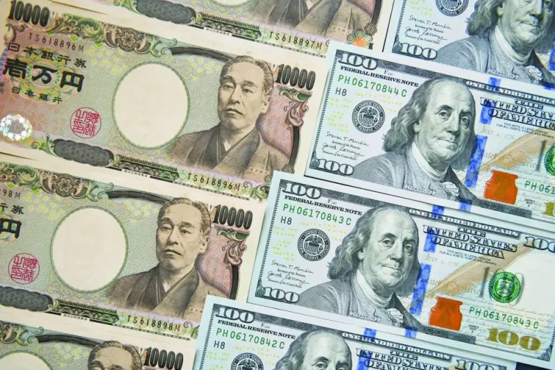 Japanese yen and US dollar banknotes are arranged for a photograph in Tokyo. The dollar’s resilience kept the pressure on peers this week, including the yen. The Japanese currency weakened for a 10th session in 11 on Friday, ending the session at 159.80 against the greenback — just shy of the closely watched 160 level.