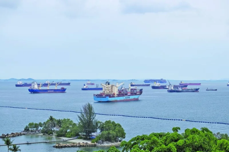 Ships anchored around Sentosa Island in Singapore on June 13. The logjam that’s been plaguing Singapore’s container port is bringing forward this year’s peak season for the shipping sector, spelling trouble for businesses in the city-state.