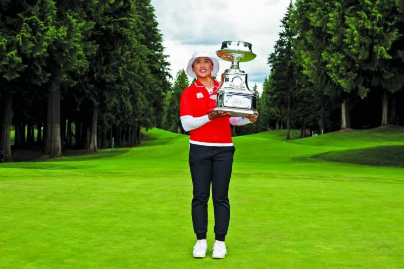 
Amy Yang of South Korea poses with the trophy after winning the 2024 KPMG Women’s PGA Championship at Sahalee Country Club in Sammamish, Washington. (AFP) 