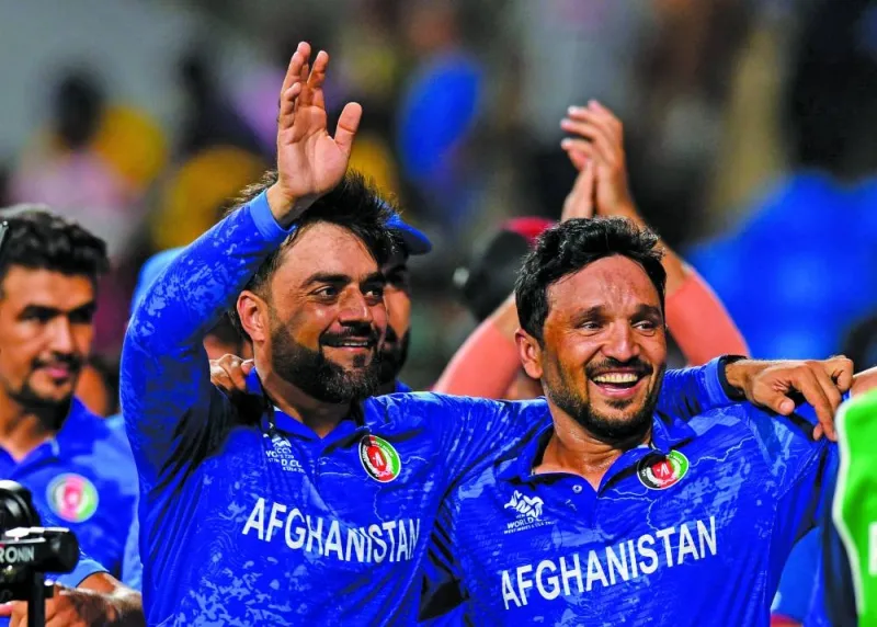 
Afghanistan’s captain Rashid Khan (left) and Gulbadin Naib celebrate their win over Bangladesh. (AFP) 